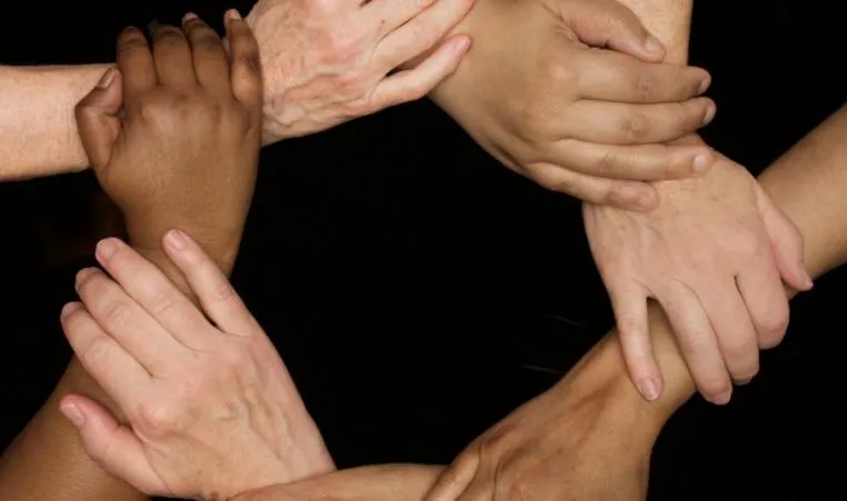diverse hands holding together