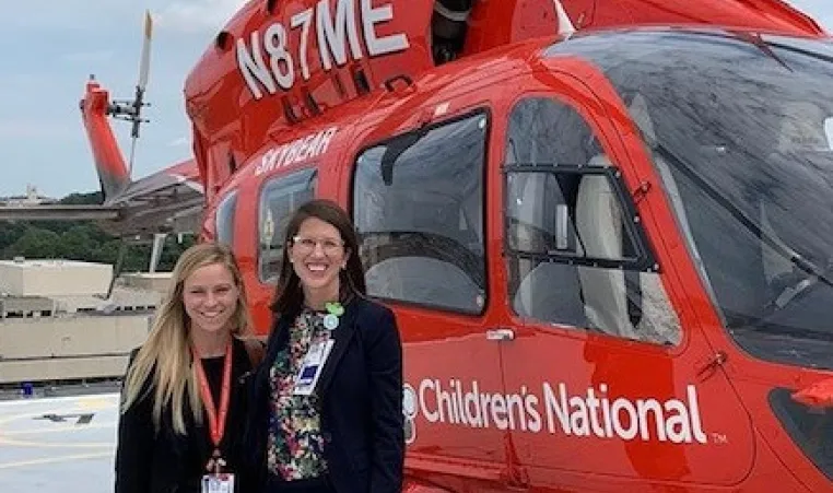picture of Dr Lexi Crawford of Children's National Hospital with a patient at a helicopter