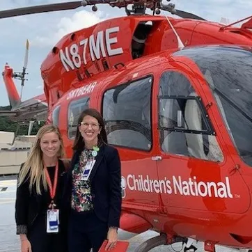 picture of Dr Lexi Crawford of Children's National Hospital with a patient at a helicopter