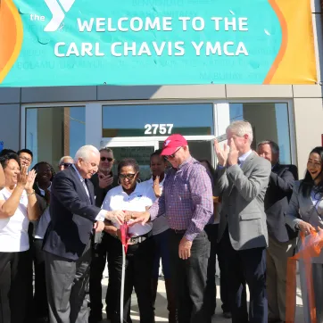 staff, volunteers and supporters celebrate Chavis Y reopening