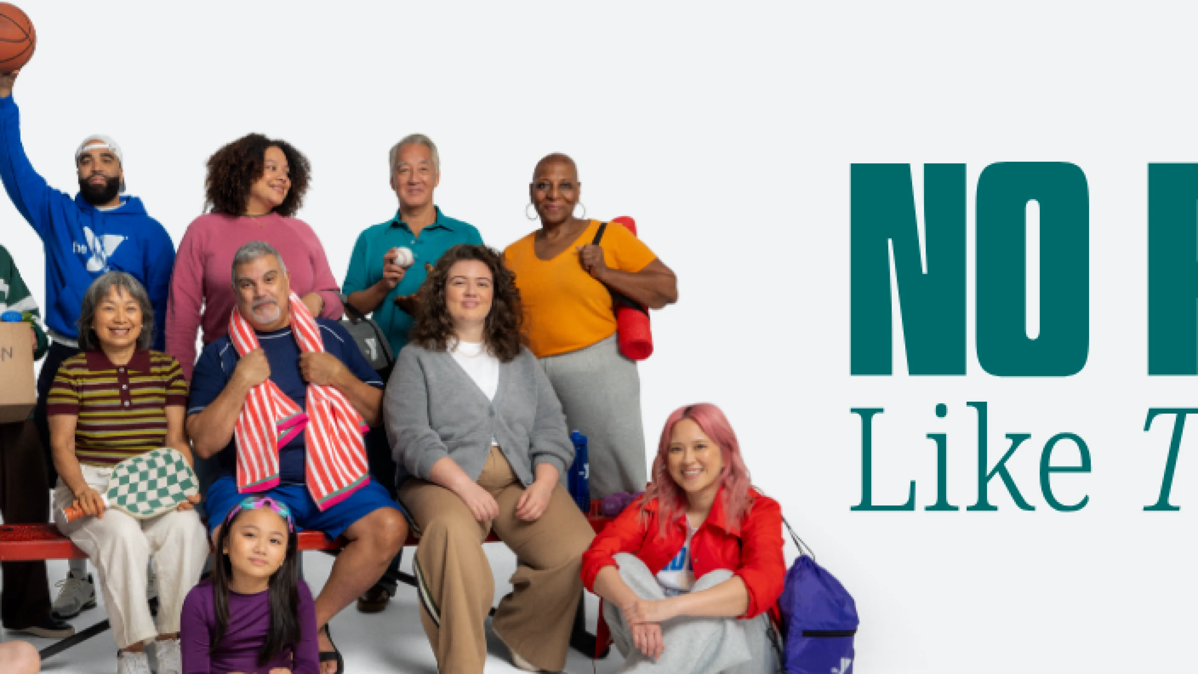 group of people of all backgrounds gathered together at the YMCA because there's no place like this place