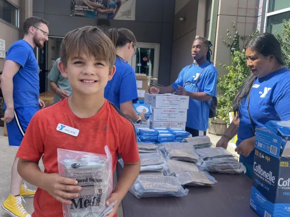 Y volunteers and staff helping to distribute food after hurricane