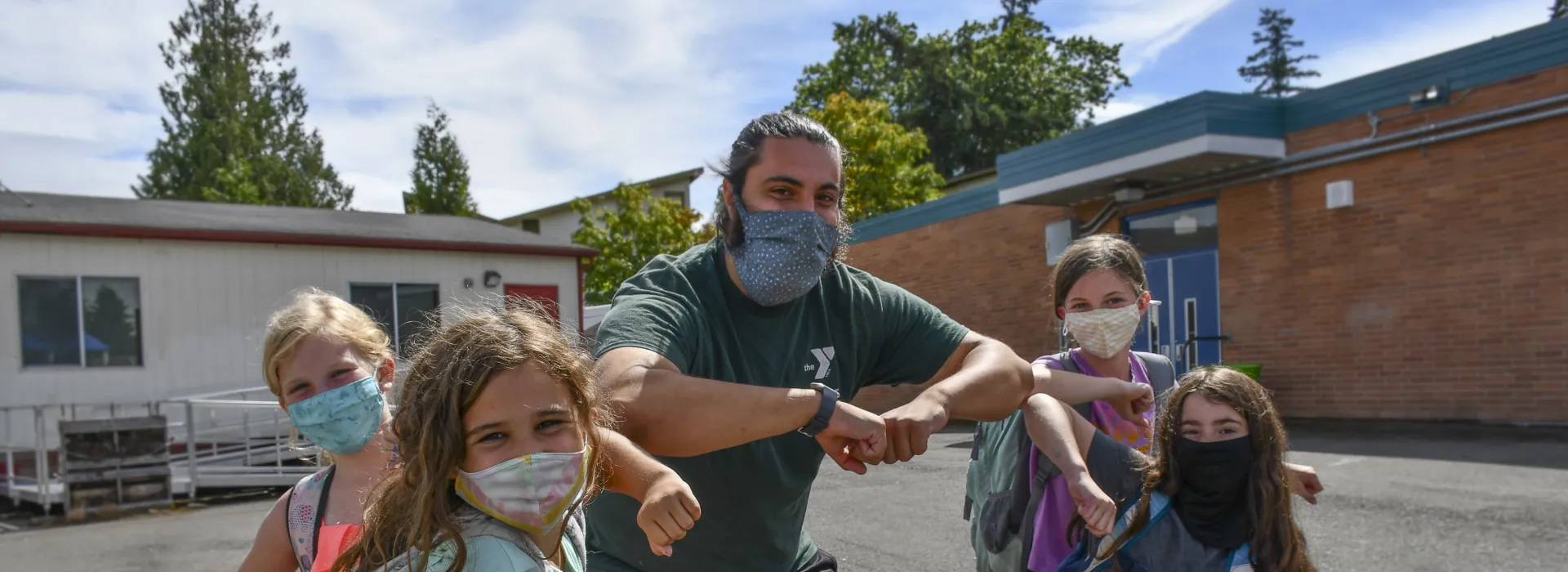 Y staffer with children outside