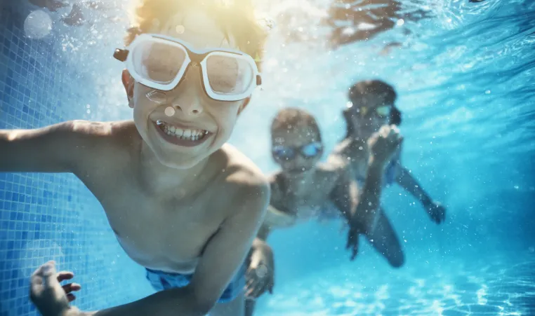 children swimming in the pool